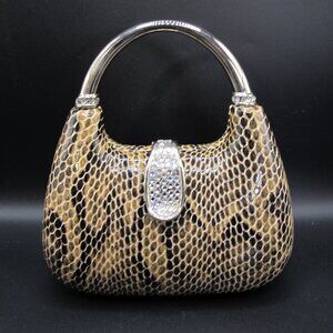 Hard clamshell clutch with snakeskin look leather cover and sequined clasp